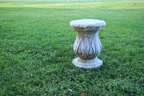 Decorative column over the grass. 스톡 사진