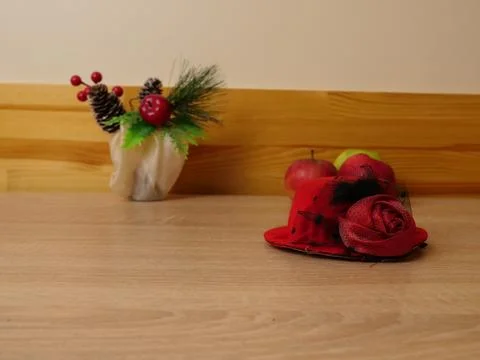 Decorative composition with apples, red flower and festive elements on wooden Stock Photos