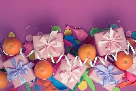 Decorative composition five boxes with gifts Satin ribbon Bow Oranges Confett Stock Photos