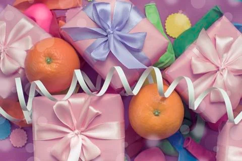 Decorative composition five boxes with gifts Satin ribbon Bow Oranges Confett Stock Photos