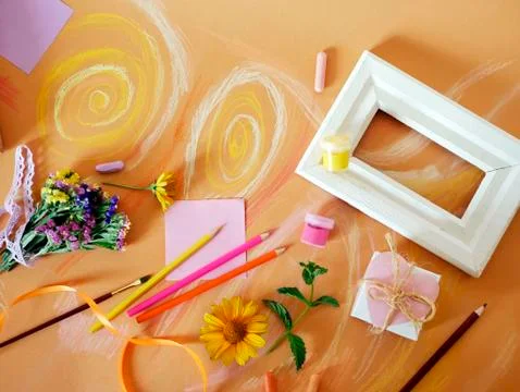 Decorative composition of hand-crafted items on yellow toned paper Stock Photos