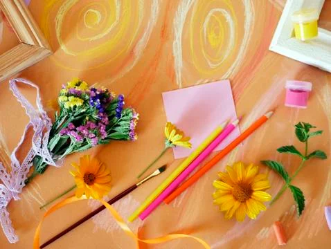 Decorative composition of hand-crafted items on yellow toned paper Stock Photos