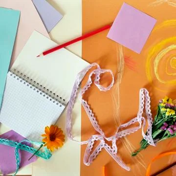 Decorative composition of hand-crafted items on yellow toned paper Stock Photos