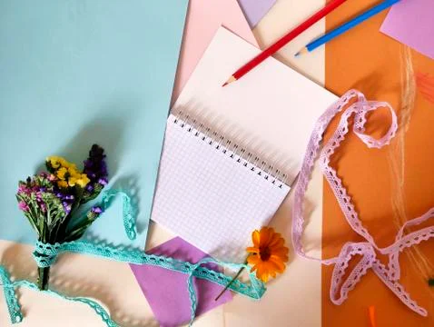 Decorative composition of hand-crafted items on yellow toned paper Stock Photos