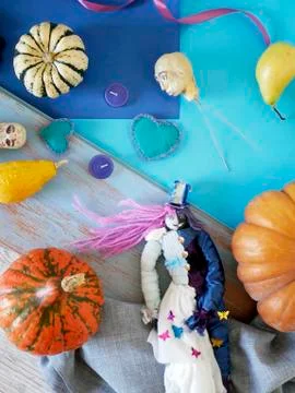 Decorative composition of pumpkins, pears, stitched dolls and felt hearts Stock Photos