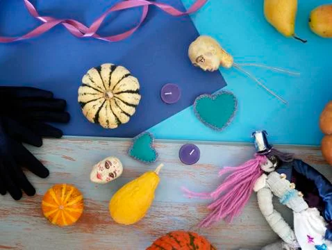 Decorative composition of pumpkins, pears, stitched dolls and felt hearts Stock Photos