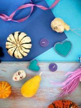Decorative composition of pumpkins, pears, stitched dolls and felt hearts Stock Photos