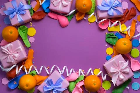 Decorative composition Three boxes with gifts Satin ribbon Bow Oranges Confet Stock Photos