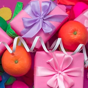 Decorative composition two boxes with gifts Satin ribbon Bow Oranges Confetti Stock Photos