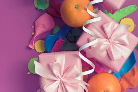Decorative composition two boxes with gifts Satin ribbon Bow Oranges Confetti Stock Photos