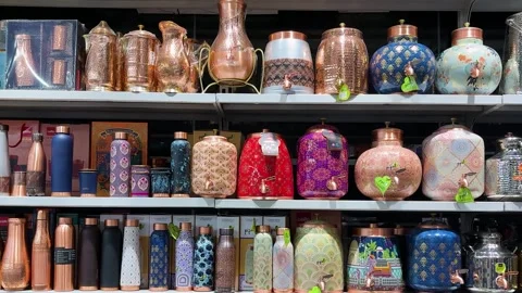 Decorative Copper Water Containers And Bottles Showcased In Homeware Store .. Stock Footage 339480815