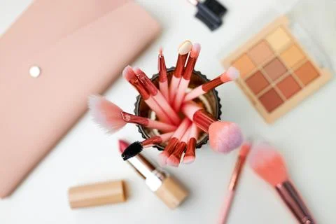 Decorative cosmetics on dressing table in makeup room Stock Photos