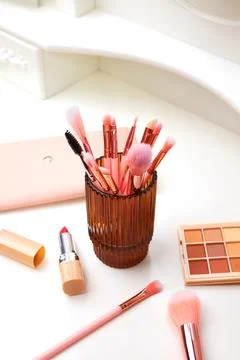 Decorative cosmetics on dressing table in makeup room Stock Photos