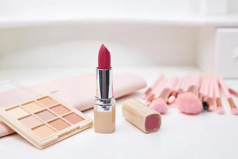 Decorative cosmetics on dressing table in makeup room Stock Photos