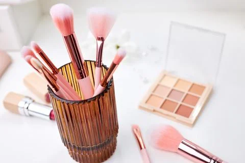 Decorative cosmetics on dressing table in makeup room Stock Photos