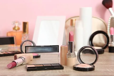 Decorative cosmetics for makeup on a dressing table close-up. Stock Photos