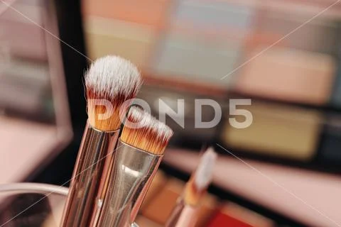 Decorative cosmetics on pink background. close up Stock Photos