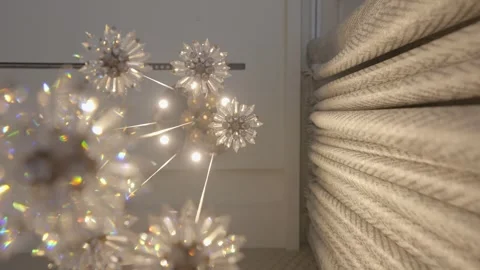 Decorative crystal light fixture with multiple starburst floral elements Stock Footage 328499026