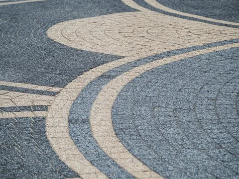 Decorative Curved Pavement Pattern Mosaic With Blue and Beige Stone Tiles I.. Stock Photos
