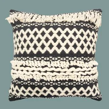 Decorative cushion with knitted pattern. Stock Photos