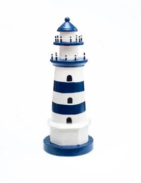 Decorative dark blue lighthouse Stock Photos