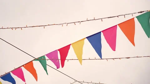 Decorative decoration in form of colorful triangular flags and glowing Christmas Stock Footage 168100376