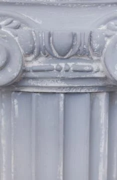 Decorative detail of an ancient Ionic column. close up. Stock Photos