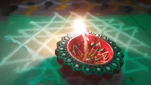 Decorative Diya Flame Flickering During Diwali Celebration Video stock 334861304