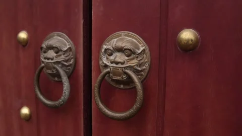 Decorative door knobs on ancient wooden door at temple in the mountainous 스톡 동영상 277321642