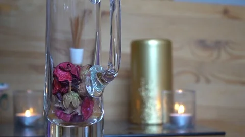 Decorative dry rose leaf slow motion fall down into the glass Stock Footage 92091034