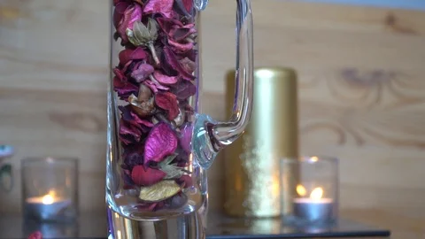 Decorative dry rose leaf slow motion fall down into the glass Stock Footage 92091347