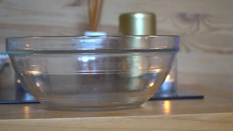 Decorative dry rose leaf slow motion fall down into the glass Stock Footage 92091793