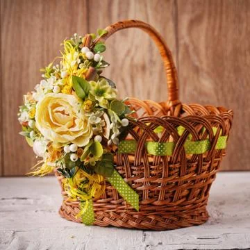 Decorative Easter basket with flowers Stock Photos
