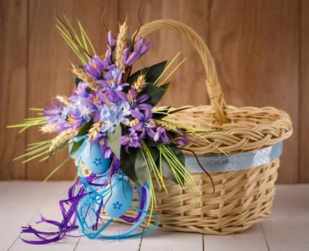 Decorative Easter basket with flowers Stock Photos