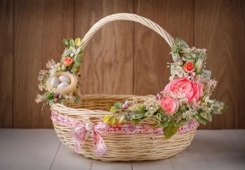 Decorative Easter basket with flowers Stock Photos