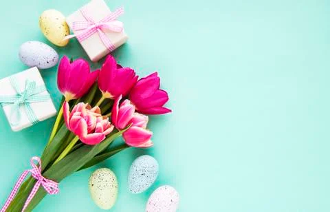 Decorative Easter eggs and tulips Stock Photos