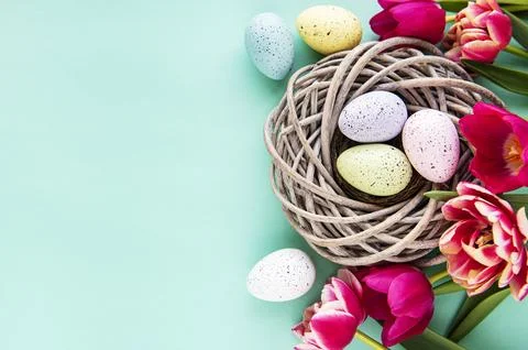 Decorative Easter eggs and tulips Stock Photos