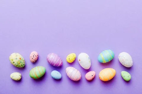 Decorative easter eggs on colored background. easter eggs collection top view Stock Photos