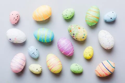 Decorative easter eggs on colored background. easter eggs collection top view Stock Photos