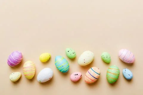 Decorative easter eggs on colored background. easter eggs collection top view Stock Photos