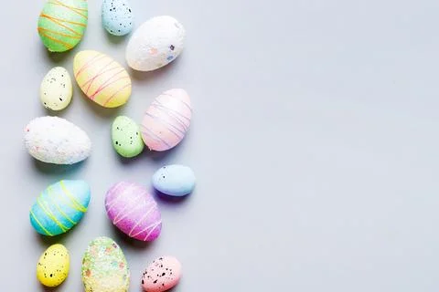 Decorative easter eggs on colored background. easter eggs collection top view Stock Photos