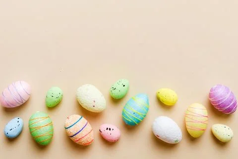 Decorative easter eggs on colored background. easter eggs collection top view Stock Photos