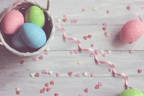 Decorative easter eggs on white wooden background Stock Photos