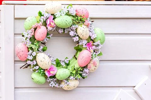 Decorative Easter wreath with bright eggs. Handmade Easter wreath Stock Photos