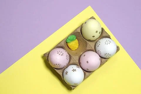 Decorative eggs on a paper egg substrate Stock Photos