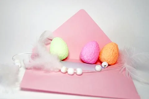 Decorative eggs on pink envelope, Easter card 스톡 사진