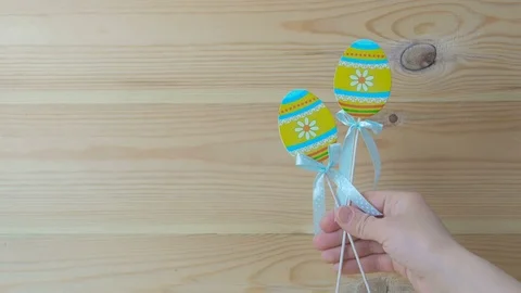 Decorative eggs with wooden sticks. Easter decoration. Interior decor. Hand Stock Footage 74026555