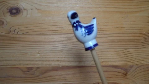 Decorative element - ceramic shape of duck moving on wooden background Stock Footage 93072485