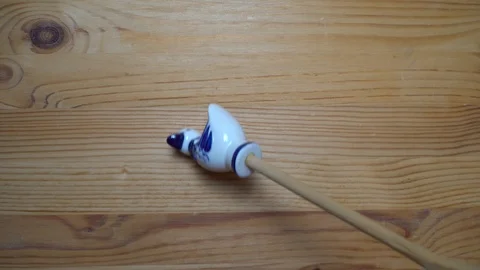 Decorative element - ceramic shape of duck moving on wooden background Stock Footage 93072979