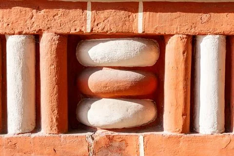 Decorative element of the wall of an ancient temple Stock Photos